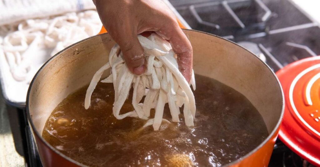 Cooking the noodles for Khao Piak