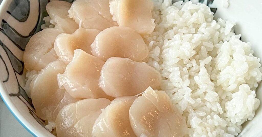Sliced scallops before searing.